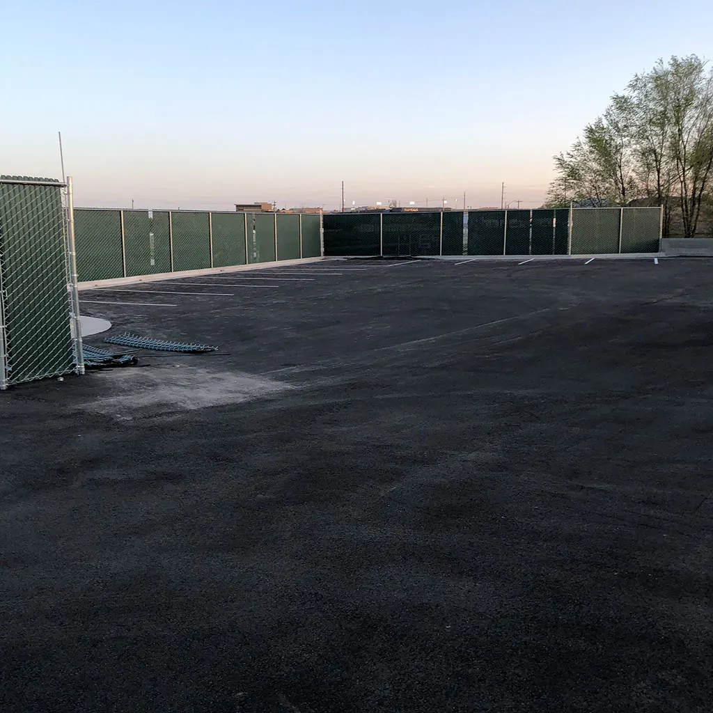 Commercial chain-link security fence with privacy screening in Utah County
