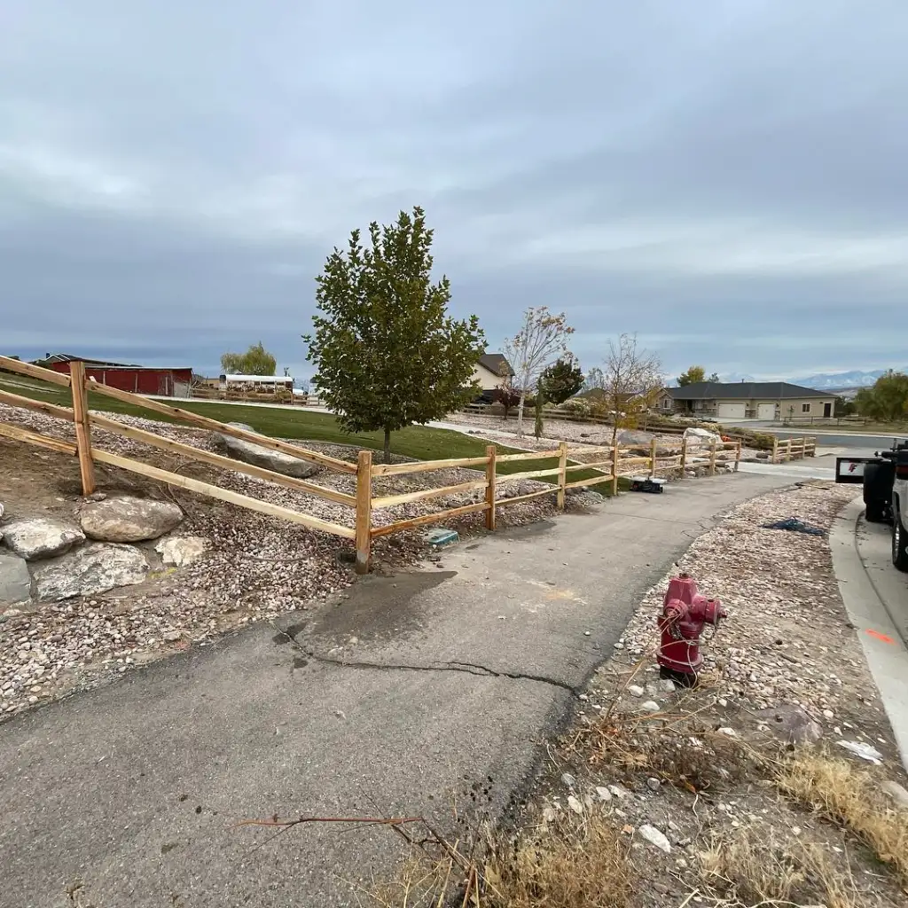 Lodge-pole fence following a sloped residential property in Eagle Mountain, Utah