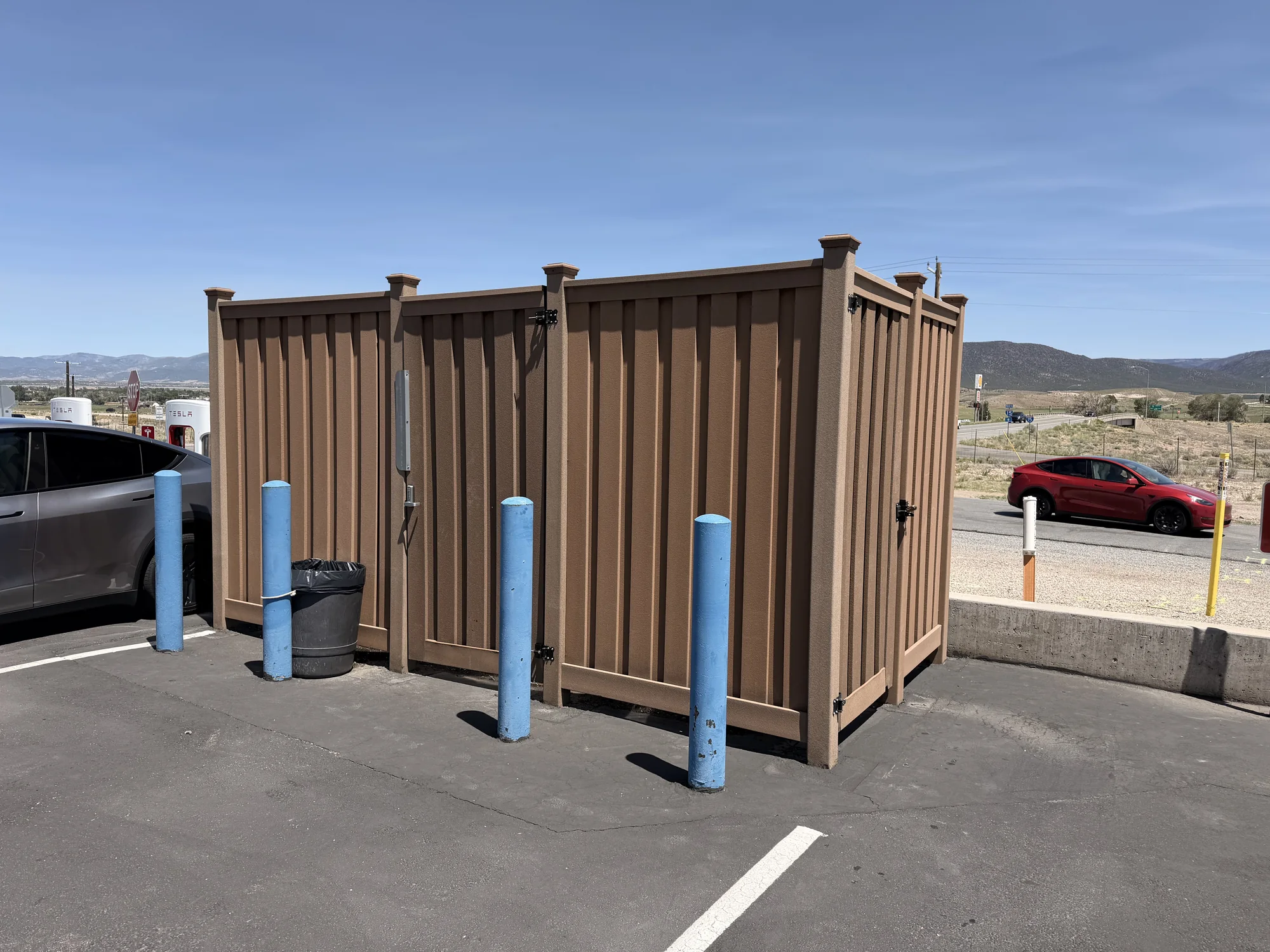 Brown Trex commercial equipment enclosure with matching access doors at a Utah property