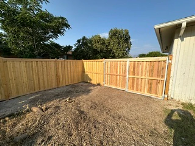 Backyard cedar privacy corner installed at a Utah property