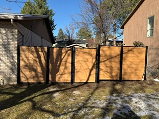 Cedar and steel driveway gate installed at a Utah property