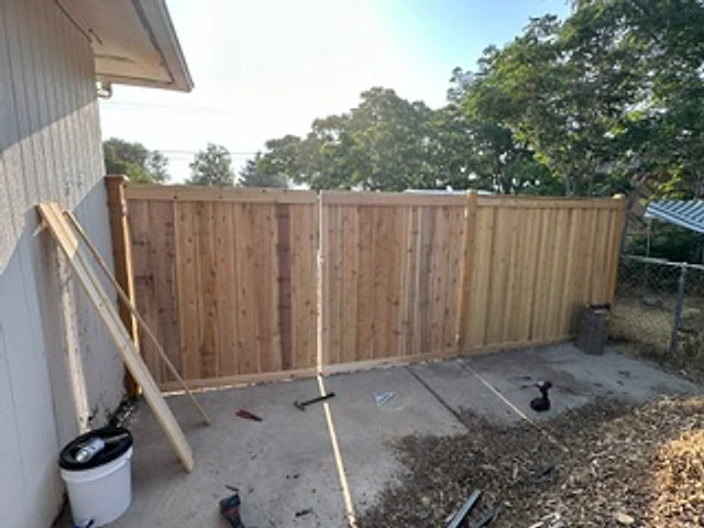 Cedar backyard gate corner installed at a Utah property