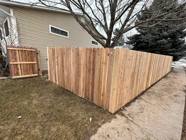 Cedar corner with access gate installed at a Utah property