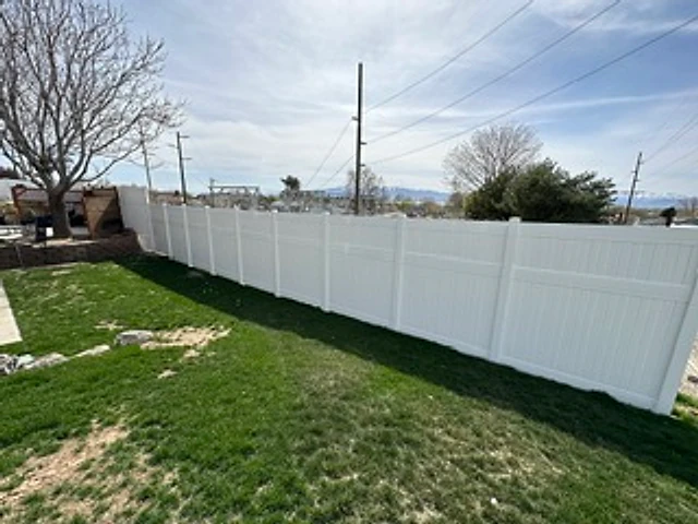 Full white vinyl backyard installed at a Utah property
