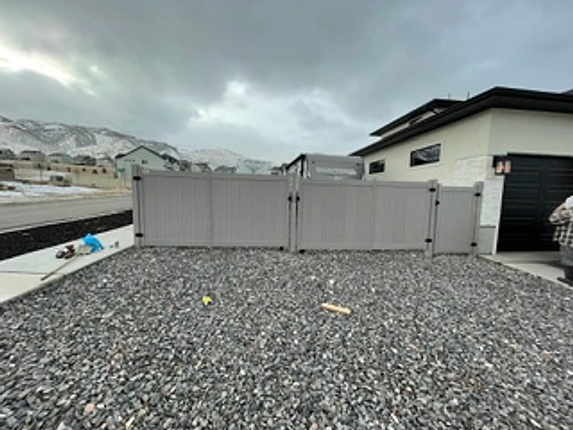 Gray privacy double gate installed at a Utah property