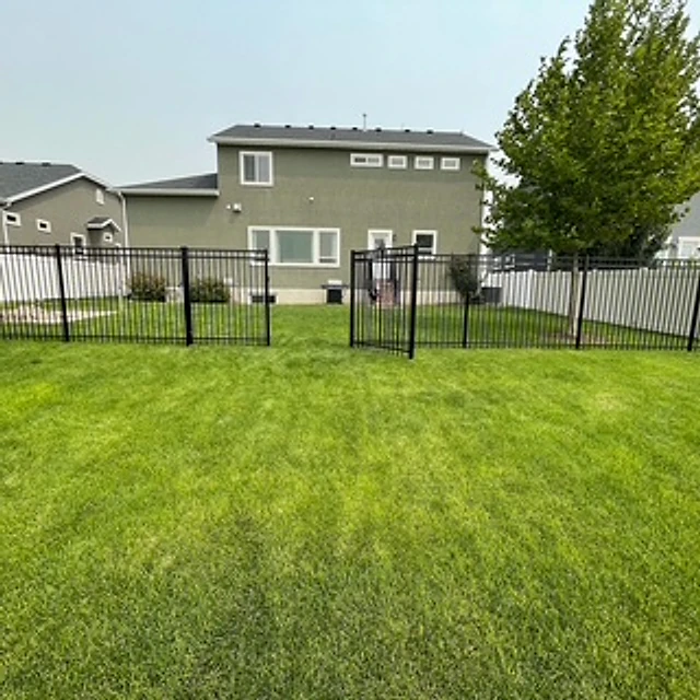Iron lawn and vinyl transition installed at a Utah property