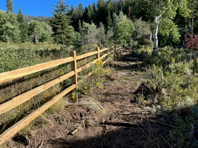 Mountain split-rail boundary installed at a Utah property