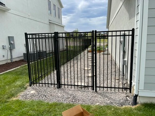 Side-yard iron enclosure installed at a Utah property
