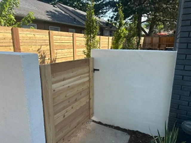 Stucco-wall cedar screen installed at a Utah property