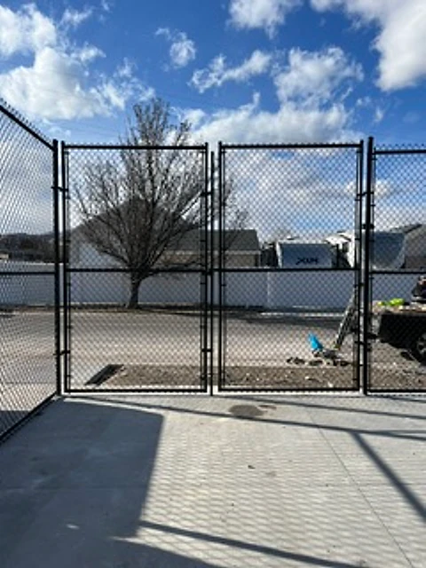 Tall chain-link double gate installed at a Utah property