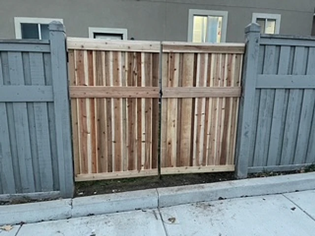 Two-tone cedar walk gate installed at a Utah property