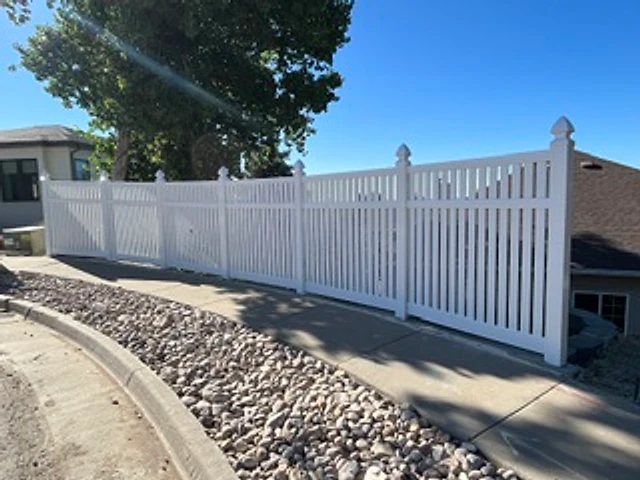 White vinyl picket curve installed at a Utah property