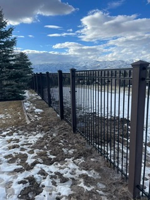 Winter iron garden gate installed at a Utah property